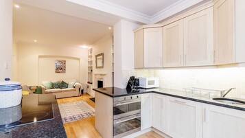 Luxury Apartment | Private kitchen | Full-size fridge, microwave, oven, stovetop