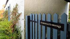 A gated entrance with a sign reading "DORROCH BEAG". - Darroch Beag Cottage, nearby Loch Fyne, peaceful location (St Catherines, Cairndow)