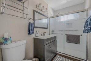 Shower, hair dryer, towels, shampoo