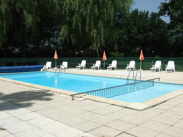 Seasonal outdoor pool, open 10:00 AM to 8:00 PM, pool umbrellas