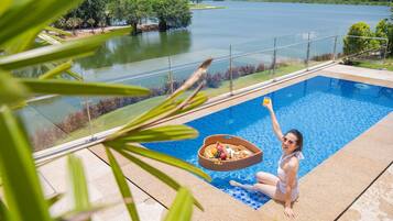 Outdoor pool, open 6:00 AM to 10:00 PM, pool loungers