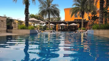 Outdoor pool, open 6:00 AM to 10:00 PM, pool loungers