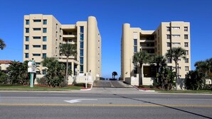 A modern hotel with a symmetrical facade, multiple floors, and a central entrance. - Two Bedroom Condo, Ormond Beach, FL 1853114 (Ormond Beach)