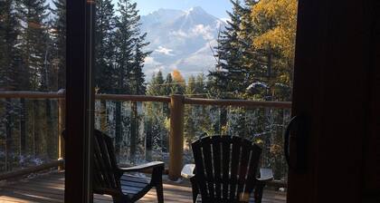 Golden Log House above the Valley