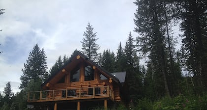 Golden Log House above the Valley