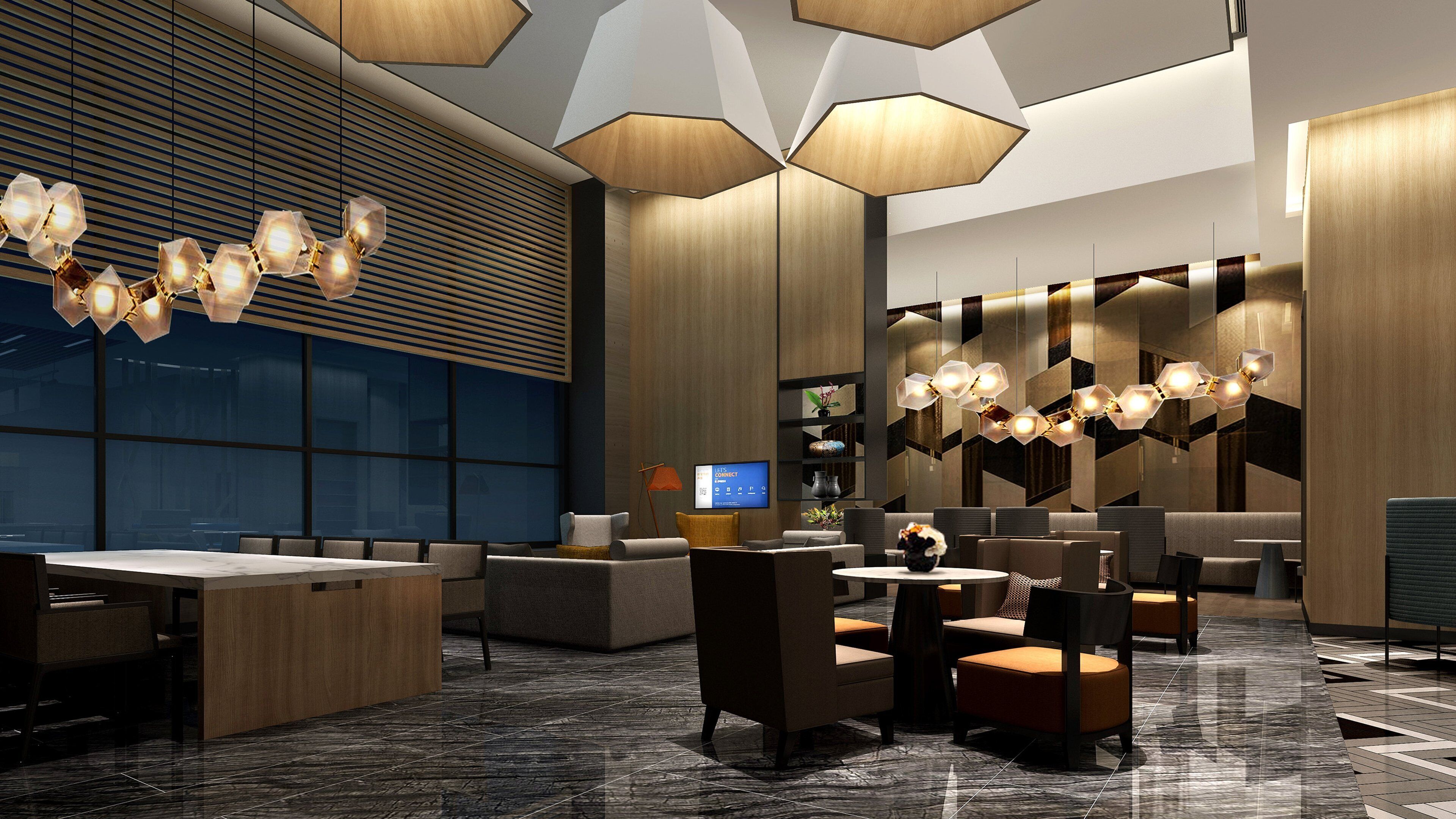 Eine moderne Hotelhalle mit einer Rezeption, einer Sitzecke und einem großen Bildschirm.