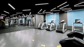 A modern gym with treadmills, weight machines, and a clean, well-lit interior. - Holiday Inn Express Liaocheng Chiping by IHG (Liaocheng)