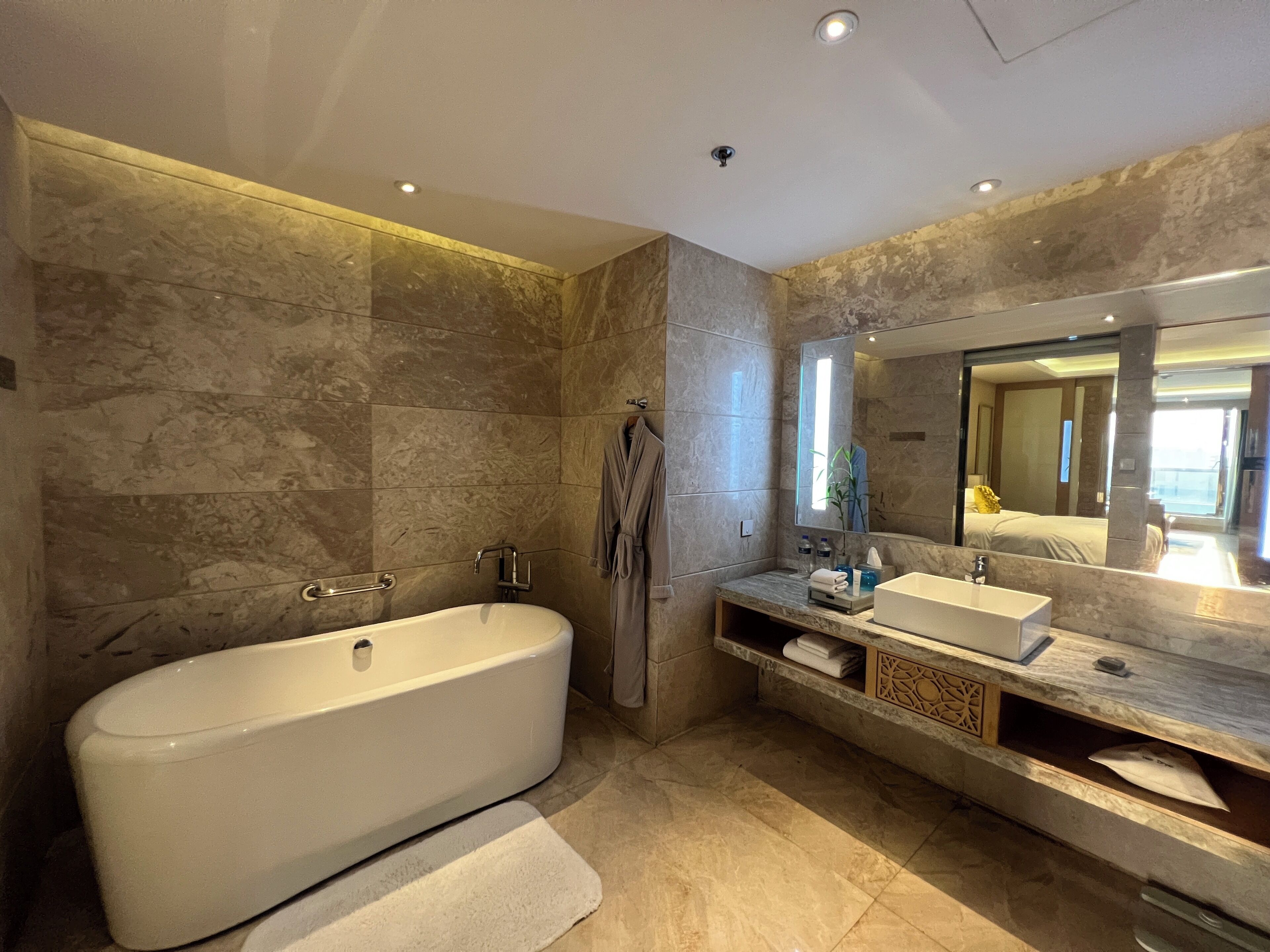 club suite, 1 king bed, city view | bathroom | combined shower/bathtub, rainfall showerhead, designer toiletries