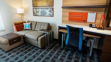 Desk, laptop workspace, iron/ironing board, free cribs/infant beds