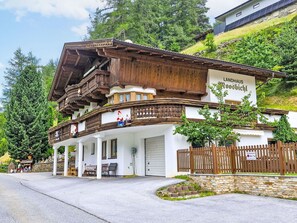 A traditional wooden building with a sign reading "Landhaus Rösbichl".