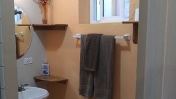Shower, hair dryer, towels, toilet paper