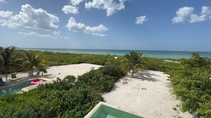 On the beach, sun-loungers
