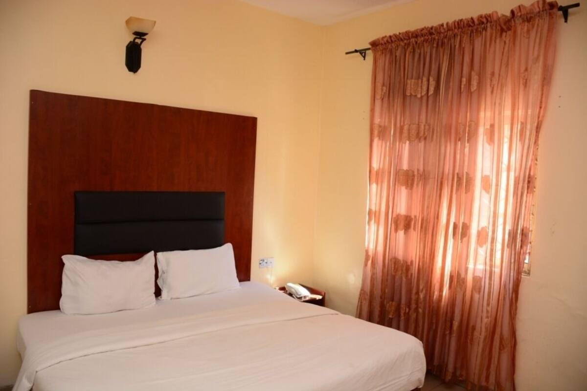 Desk, blackout curtains, bed sheets