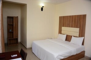 Desk, blackout curtains, bed sheets