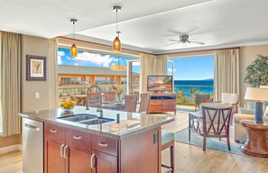 Enjoy meals in the kitchen with a central island and oven, then dine al fresco on the balcony overlooking the ocean.