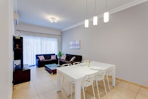 Apartment (1 Bedroom) | Living room | 40-inch LCD TV with cable channels, TV