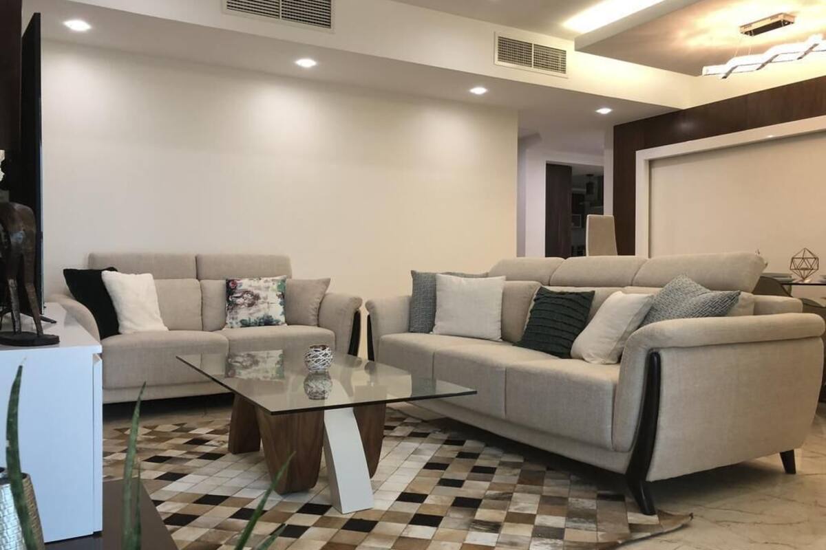 65-inch flat-screen TV with satellite channels, TV