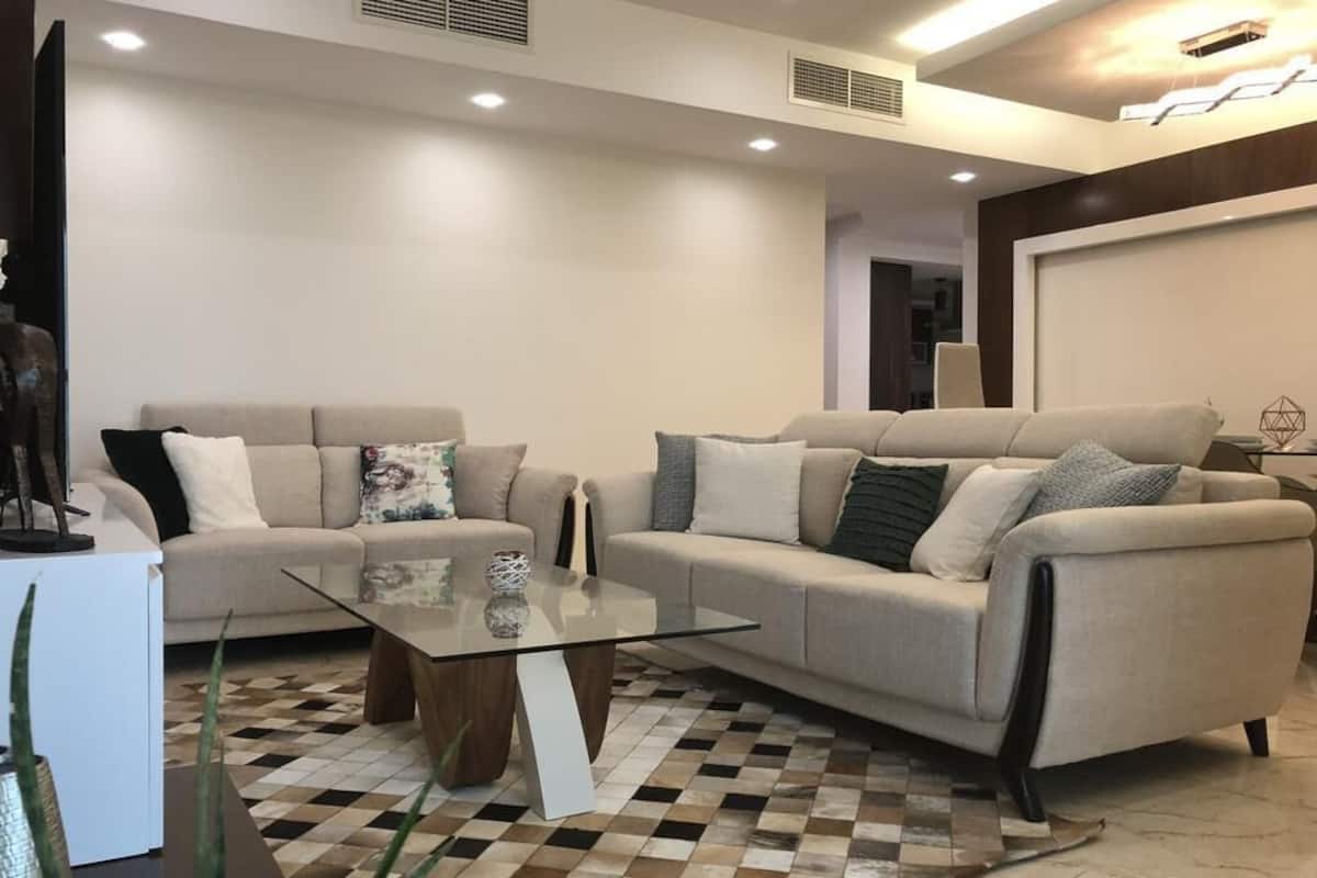 65-inch flat-screen TV with satellite channels, TV