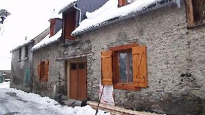 A rustic stone building with wooden shutters and a snow-covered roof. - House / Villa - VIGNEC (Vignec)