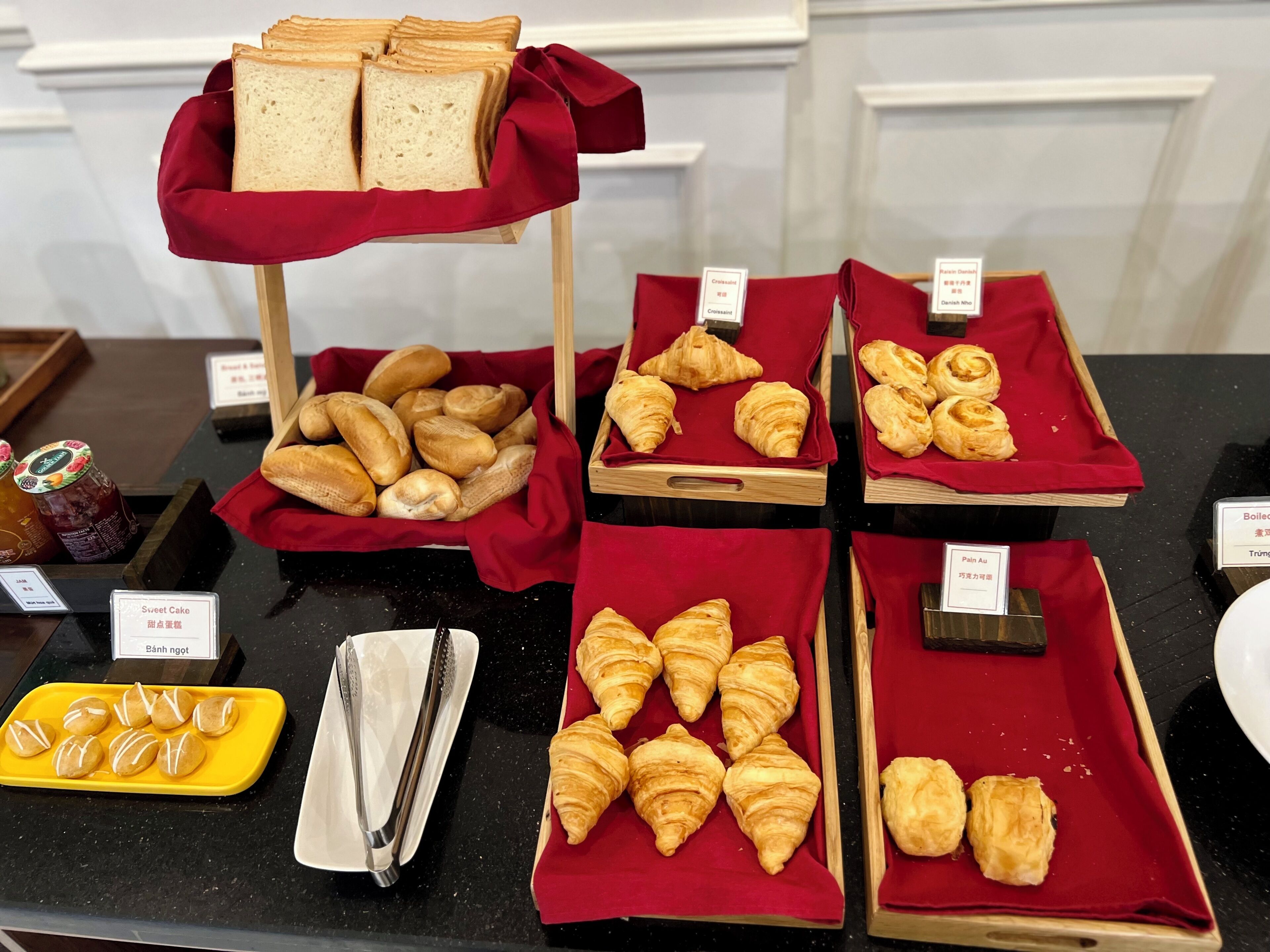 A bakery display with various baked goods.