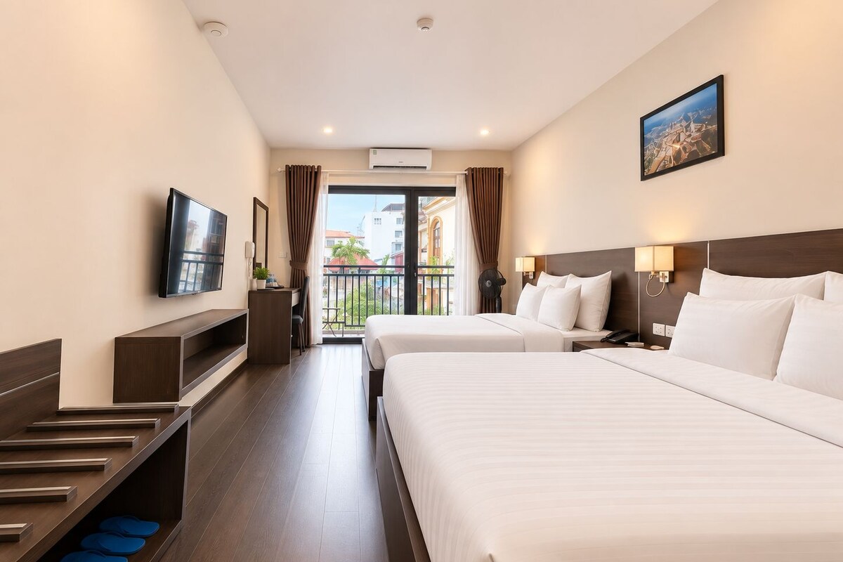 Family Room, 2 Queen Beds, Balcony, City View | Minibar, in-room safe, desk, laptop workspace