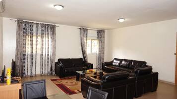 Apartment, 1 Bedroom | Living room | 32-inch flat-screen TV with cable channels, TV