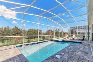 A covered outdoor swimming pool with a clear view of the surrounding landscape. - Ev7812ha - Champions Gate Resort - 8 Bed 5 Baths Villa (Kissimmee)
