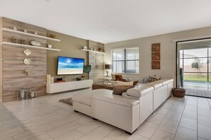 Family Villa, Multiple Bedrooms, Garden Area | Living room | Flat-screen TV, video game console - Vhc7819ha - Champions Gate Resort - 9 Bed 5 Baths Villa (Davenport)