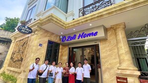 A building with a sign reading "Zoli Home Hotel". - O Zoli Home (Ninh Binh)
