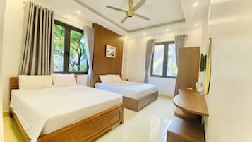 Superior Quadruple Room | Minibar, in-room safe, desk, laptop workspace