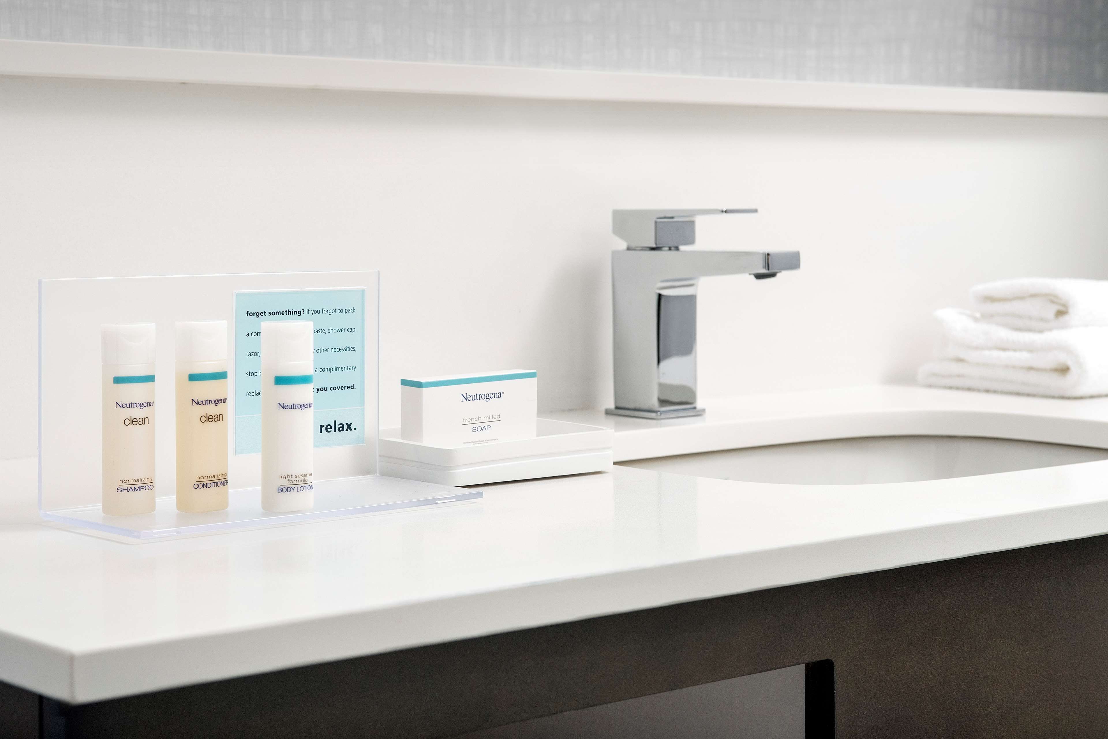 hair dryer, towels, soap, shampoo