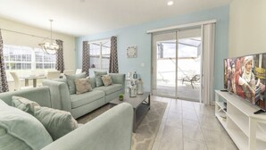 Family Townhome, Garden Area | Living room | Flat-screen TV, video game console - Vhc7831ha - Champions Gate Resort - 5 Bed 4 Baths Townhouse (Davenport)