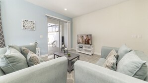 Family Townhome, Garden Area | Living room | Flat-screen TV, video game console - Vhc7831ha - Champions Gate Resort - 5 Bed 4 Baths Townhouse (Davenport)