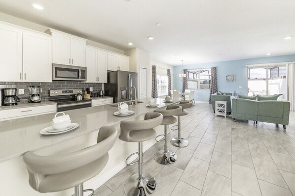 Family Townhome, Garden Area | Private kitchen