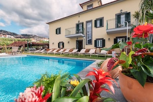 Outdoor pool, open 8:30 AM to 8:00 PM, pool loungers