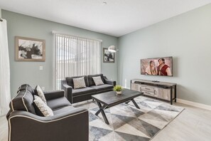 Maison mitoyenne Familiale, côté jardin | Salle de séjour | Télévision à écran plat, console de jeux vidéo