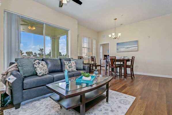 Family Townhome, Garden Area | Living room | Flat-screen TV, video-game console - Ev7855ha - Cane Island - 2 Bed 2 Baths Townhouse (Kissimmee)