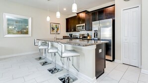Family Townhome, Garden Area | Private kitchen | Stovetop, dishwasher, cookware/dishes/utensils
