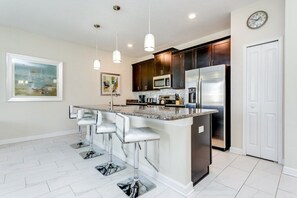 Family Townhome, Garden Area | Private kitchen