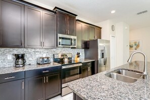 Family Townhome, Garden Area | Private kitchen