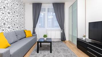 Business-Apartment | Wohnzimmer | Flachbildfernseher