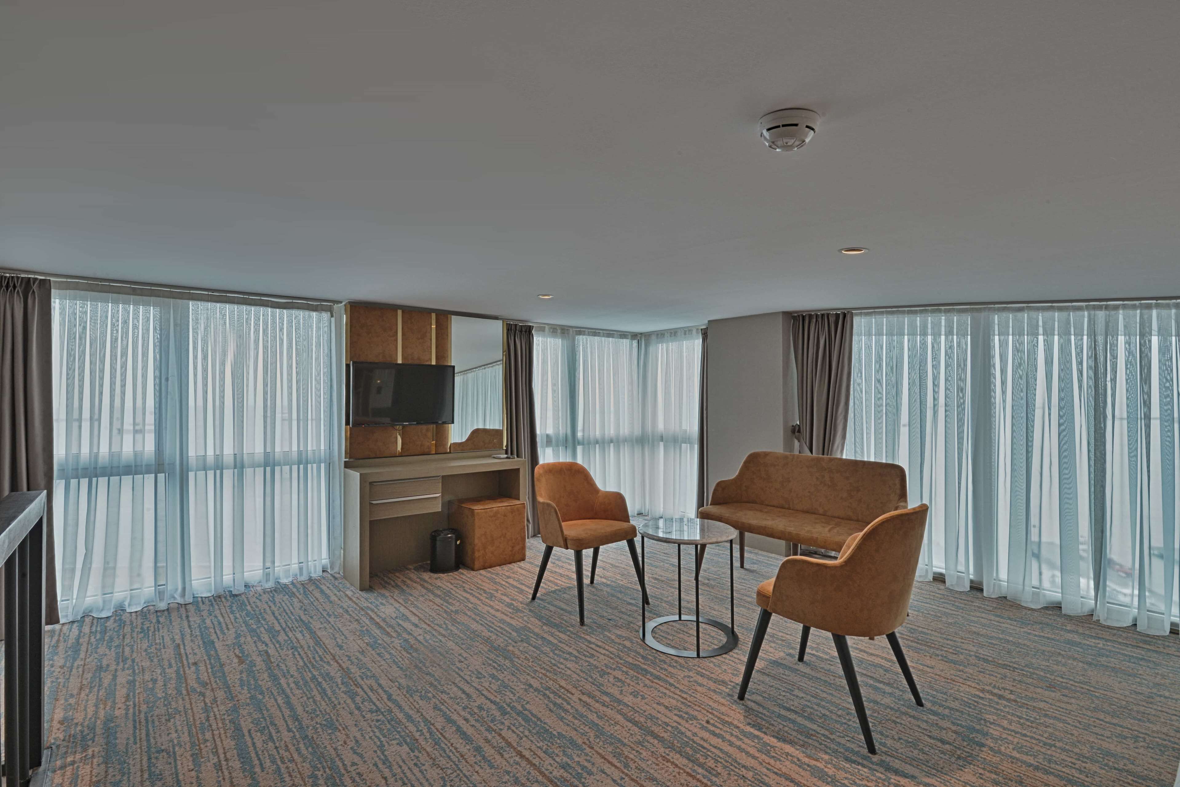 suite, multiple beds, balcony | premium bedding, minibar, in-room safe, desk