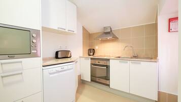 Deluxe Apartment, 2 Bedrooms | Private kitchen | Fridge, microwave, oven, stovetop