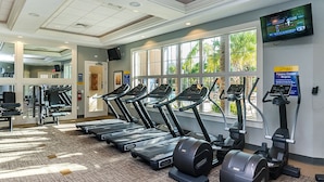 A gym with treadmills, elliptical machines, and weight equipment. - Ev7881ha - Solterra Resort - 6 Bed 4 Baths Villa (Davenport)