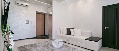 Deluxe Apartment (floor 5) | Living room | 43-inch flat-screen TV with cable channels, LED TV