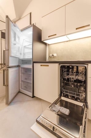 Apartment, 1 Bedroom | Private kitchen | Full-size fridge, oven, stovetop, dishwasher
