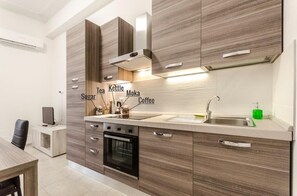 Apartment, 1 Bedroom (S.Felice Street) | Private kitchen | Full-sized fridge, oven, stovetop, espresso maker
