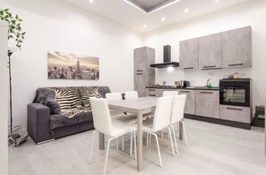 Apartment, 2 Bedrooms | Living area | 42-inch flat-screen TV with digital channels, TV - Dimora Santo Stefano (Bologna)