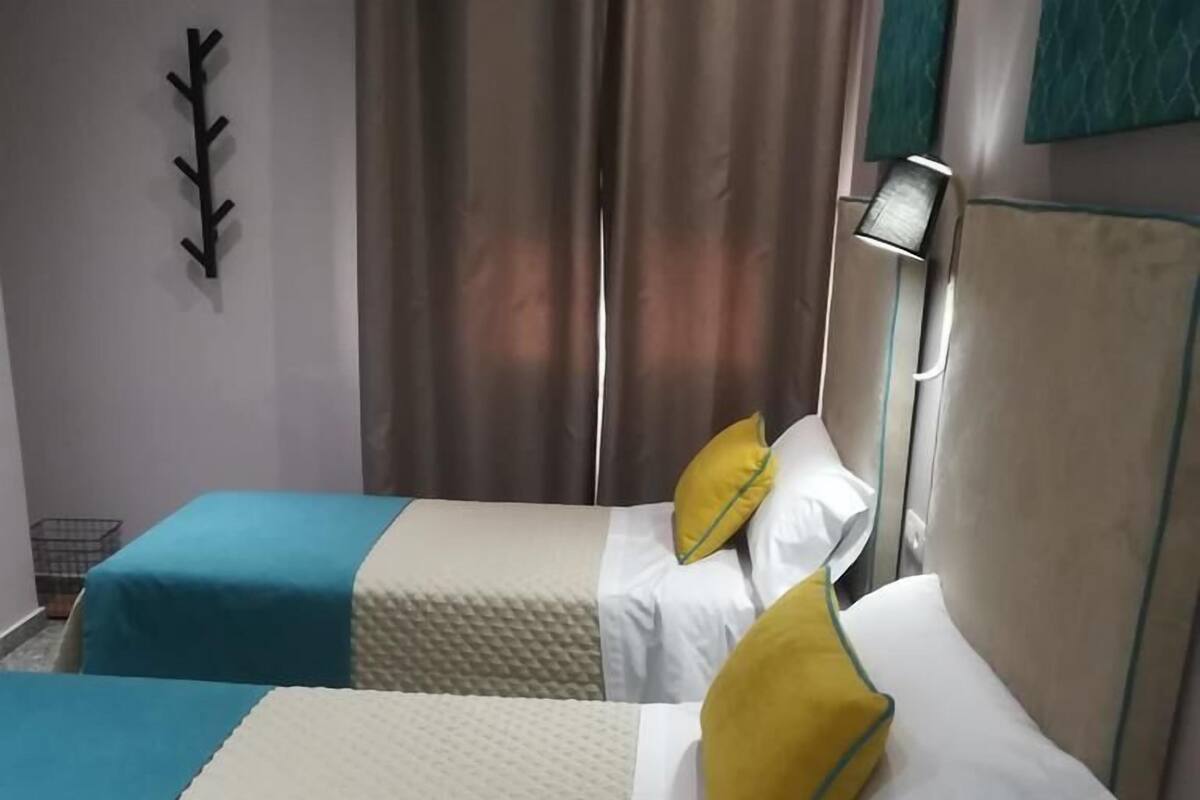 Premium bedding, laptop workspace, blackout curtains, iron/ironing board