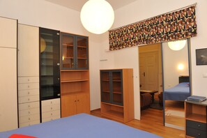 1 bedroom, desk, iron/ironing board, travel cot